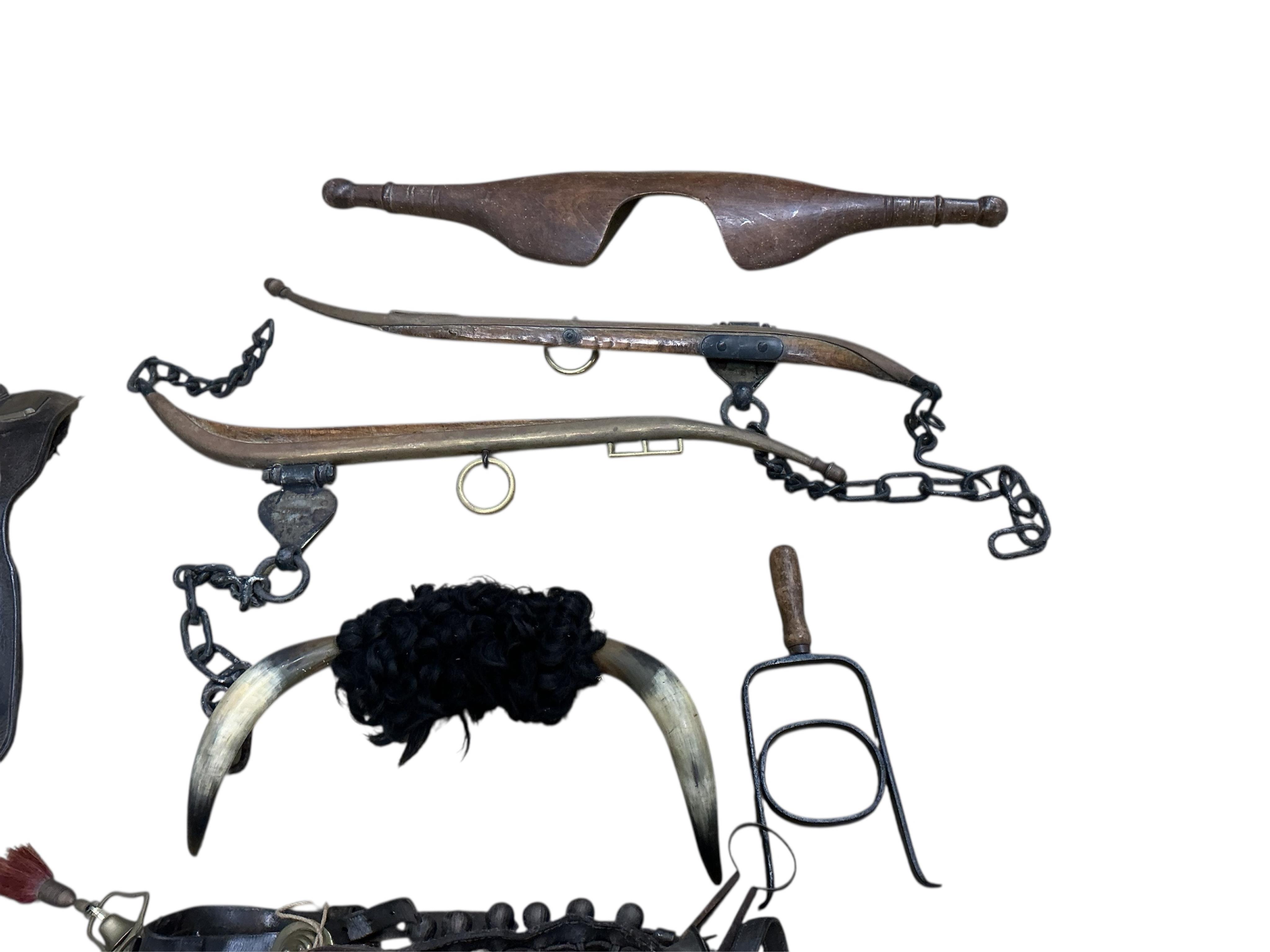 A group of 19th century agricultural items, a shire horse show bridle, etc